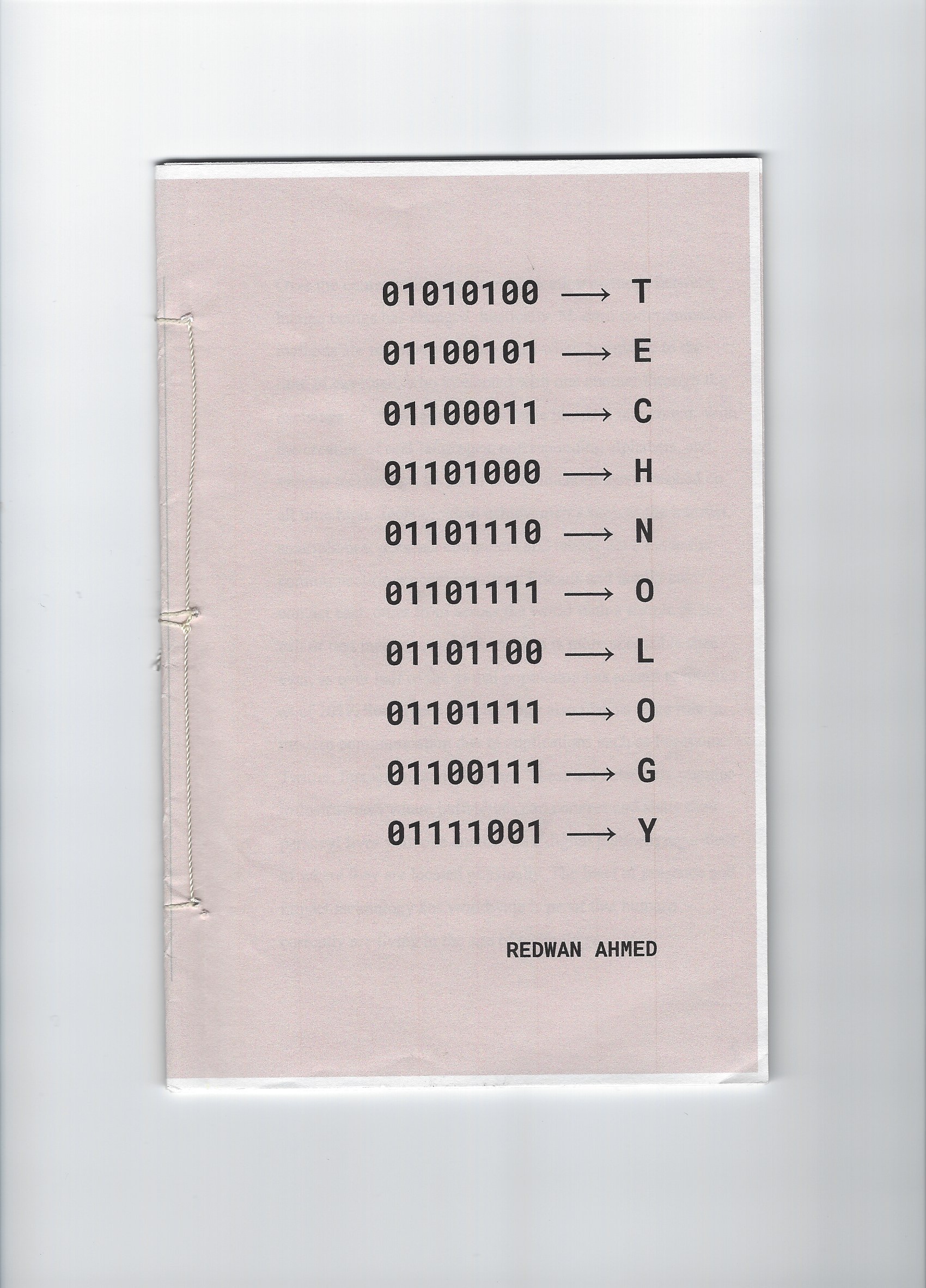 Front Cover: The front cover page that displays the title of the work in both binary code and english. The authors name is presented towards the bottom of the page.