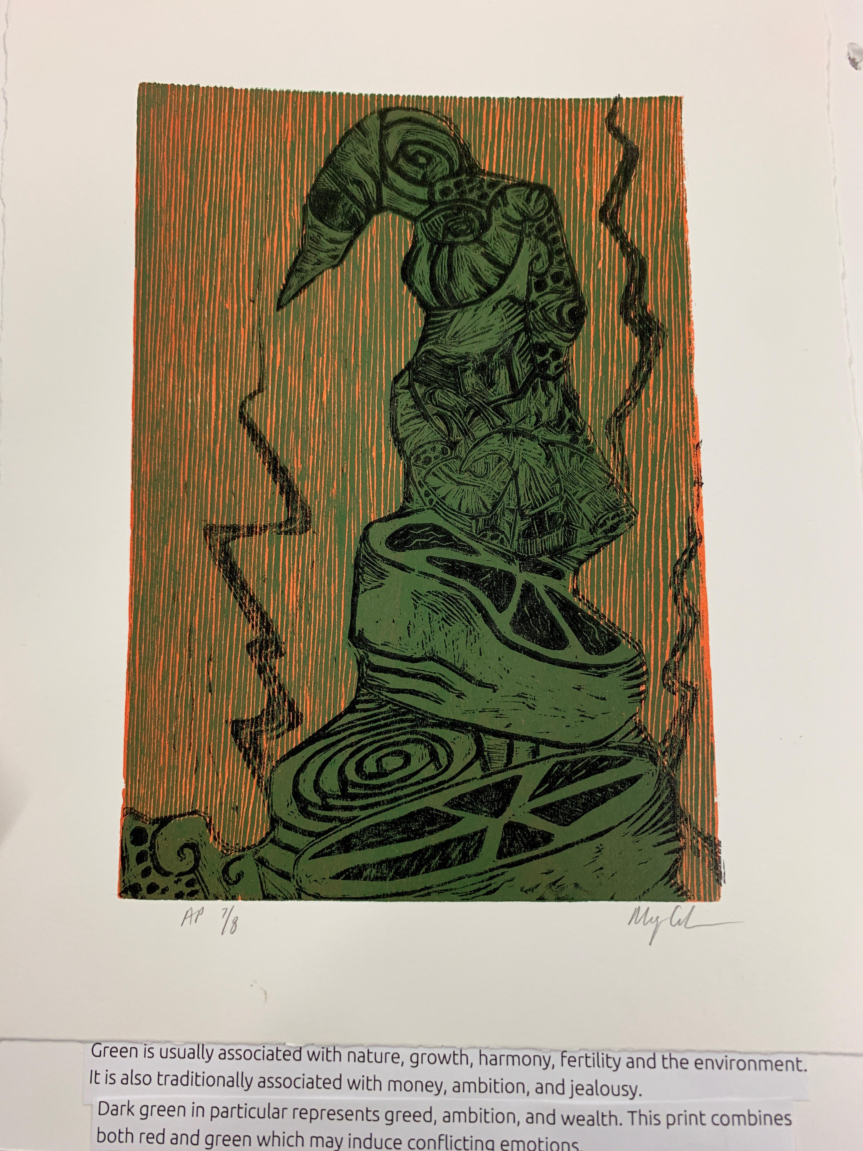 Page 5. Caption: In American society, green is typically associated with nature, growth, harmony, fertility, and the environment. It also signifies money, ambition and jealousy. The dark green presented in this abstract print is associated with greed, wealth, and ambition. The background usage of red with the predominant dark green may cause a calming and warming affect.