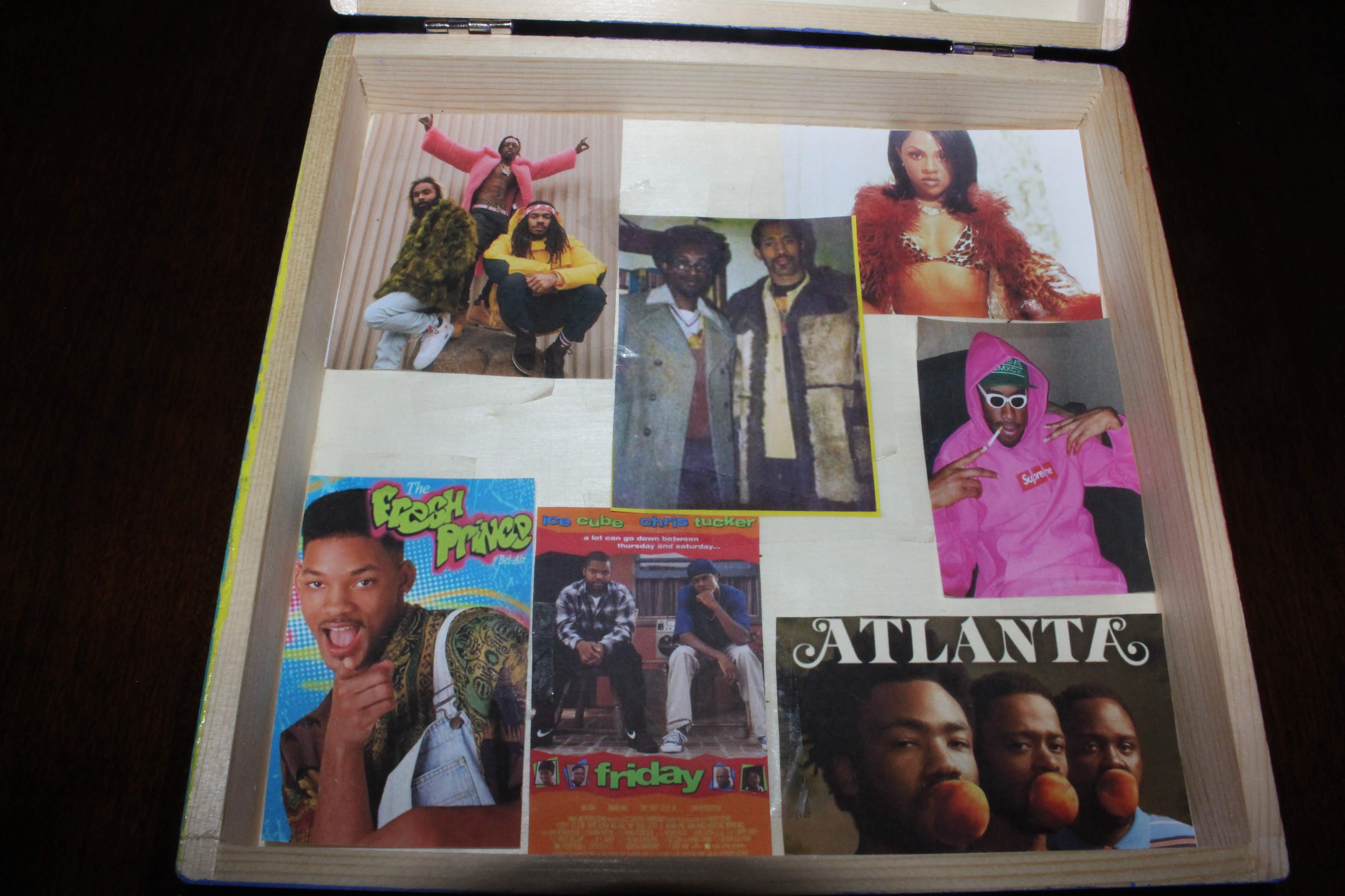 The bottom part of the inside of the box. It’s a brief summary of some of my favorite musicians, tv shows, and movies that come from hip-hop culture. In the center is an image of the ‘founders of hip-hop’.